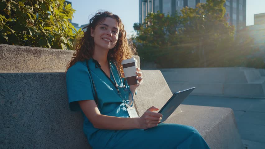 Cinematic Representation of the daily life of a nurse going to work at the hospital. Doctor on the coffee break outdoor.