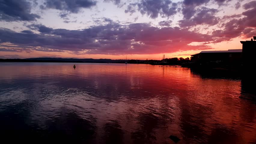 Cloudy Sunsets Over Lake in Summer
