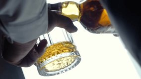 elegant man businessman millionaire in jacket and suit pours expensive whiskey into glass. Exquisite brown alcoholic drink for relaxation and enjoyment. Groom man billionaire - Powered by Shutterstock - Get 15% off with code: PIKWIZARD15