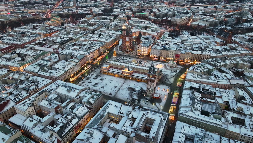 Krakow Winter Wonderland with Snow-Covered Market Square and Saint Mary Basilica