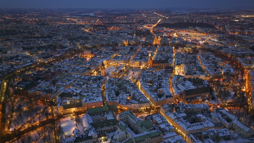 Winter evening in Krakow showcasing Market Square and St. Mary