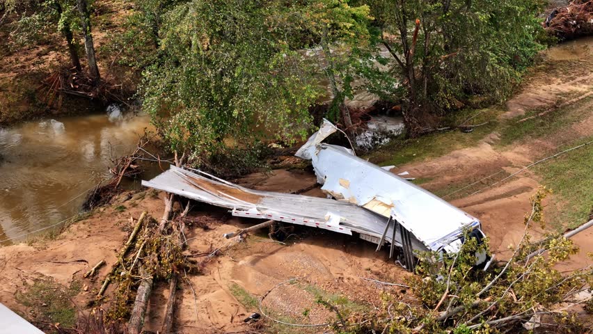Aerial footage of semi trailer destroyed in flooding from Hurricane Helene.