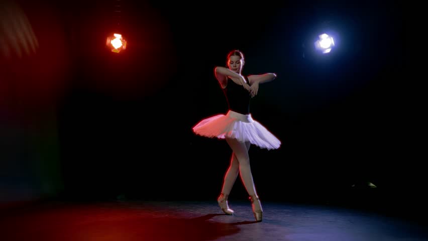 Classical ballet performance, slender woman in white tutu dancing in studio. Full-length portrait of professional ballerina, romantic mood, grace and beauty of young lady, student of school of arts