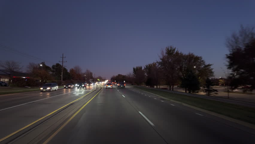 Driving in on the road at night time. Wide POV wide view shot