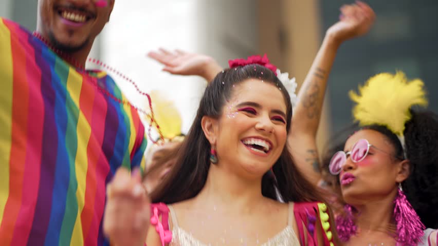 Cheerful Woman Laughing and Dancing at Brazilian Carnival Street Party. Group of Festive Friends in Vibrant Costumes Celebrating Traditional Carnaval Outdoors