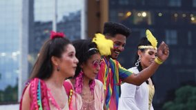 Joyful Friends Dancing and Throwing Confetti at Brazilian Carnival Celebration. Group in Colorful Costumes Enjoying Vibrant Carnaval Festivities Outdoors in the City - Powered by Shutterstock - Get 15% off with code: PIKWIZARD15
