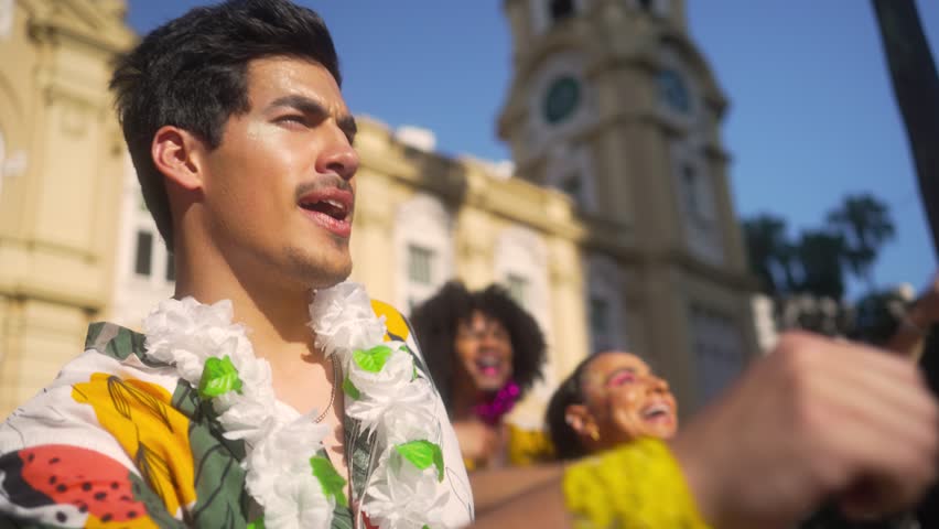 Happy Man with Friends Celebrating at Brazilian Carnival, Vibrant Street Party in Full Swing
