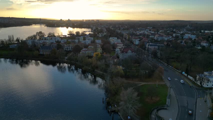 Glienicke Agent bridge in autumn, connecting potsdam and berlin over havel river, germany. Gorgeous aerial view flight fly reverse drone