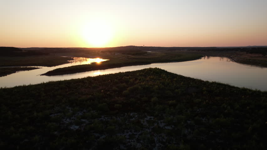 Sunset aerial view of Canyon Lake in the Texas Hill Country during a drought, low water levels