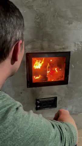 man sitting by fireplace, cosy, winter, fire, holiday, warm, happy, lifestyle, flames, male, relaxation