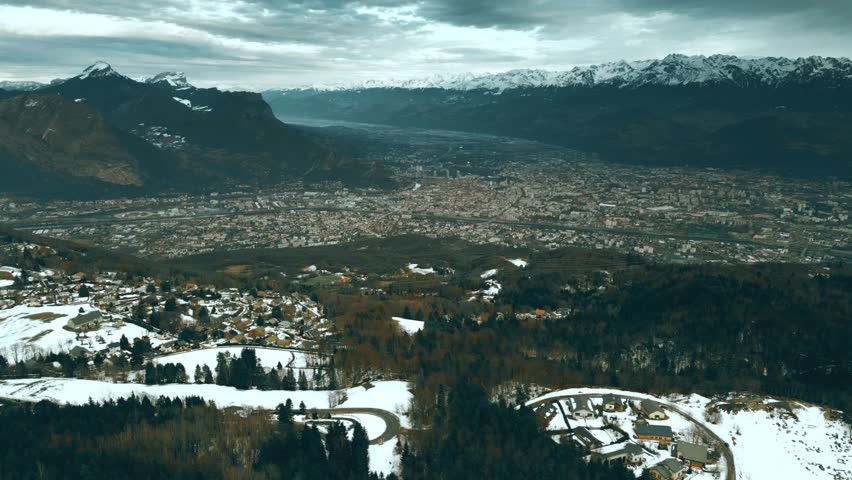Aerial shot of Grenoble and surrounding Alps in winter, France. View to the east from the Vercors mountain range