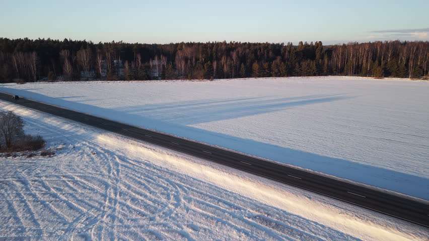 Embarking on a serene winter journey through a picturesque, snowy landscape filled with tranquility