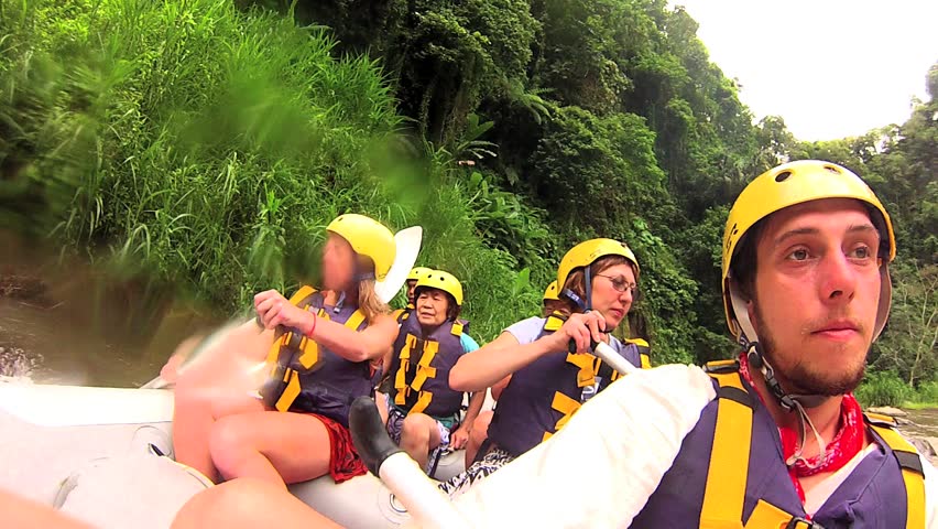BALI - JANUARY 5: Tourists white water rafting in Ayung River, on January 5,