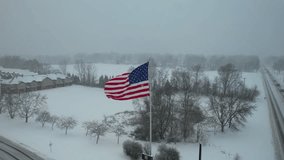 American flag waving in snow storm - Powered by Shutterstock - Get 15% off with code: PIKWIZARD15