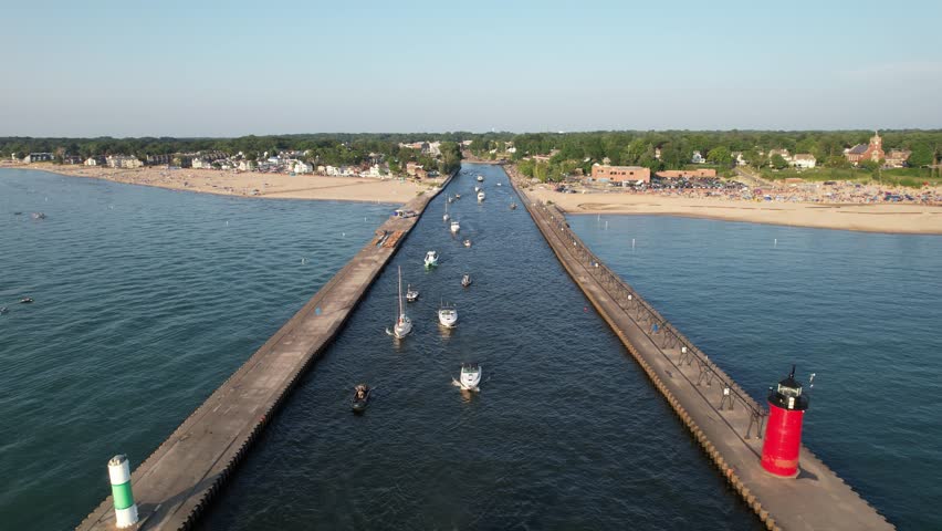 Aerial view of the light house of south haven beach with boats in lake michigan