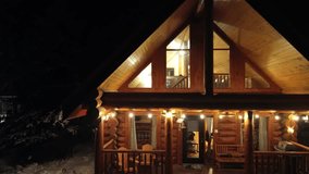 Charming wooden log chalet nestled amidst nature, exuding rustic elegance and cozy warmth. Crafted from sturdy timber, its natural textures blend harmoniously with the surrounding landscape, creating - Powered by Shutterstock - Get 15% off with code: PIKWIZARD15