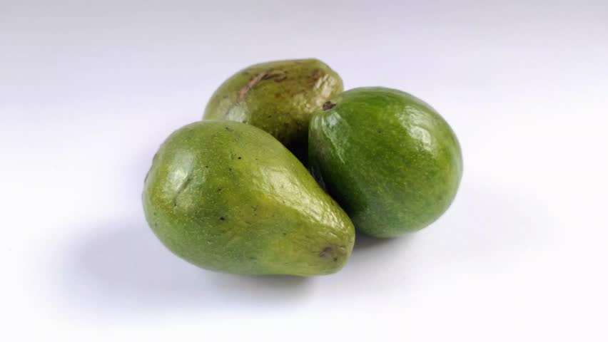 Avocado or Persea americana fruit on a white background. Avocados grow in tropical and sub-tropical climates. It has a soft and delicious texture. Contains good fat and protein.