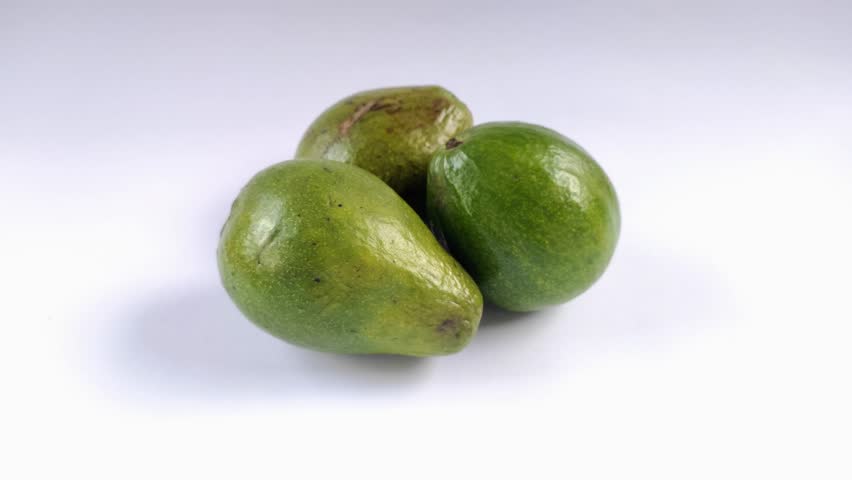 Avocado or Persea americana fruit on a white background. Avocados grow in tropical and sub-tropical climates. It has a soft and delicious texture. Contains good fat and protein.
