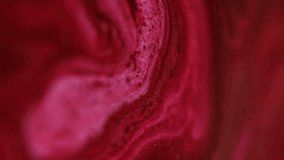 Sparkling ink wave. Paint spill. Defocused red pink color shimmering particles liquid emulsion blend flow motion abstract art background. - Powered by Shutterstock - Get 15% off with code: PIKWIZARD15