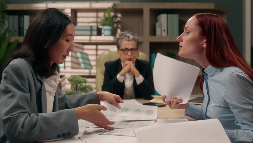 Diversity businesswomen documents business office women females arguing problem analyze data marketing discuss bad result angry negative quarrel colleagues coworkers papers company girls talking team