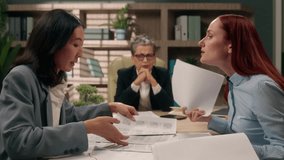 Diversity businesswomen documents business office women females arguing problem analyze data marketing discuss bad result angry negative quarrel colleagues coworkers papers company girls talking team - Powered by Shutterstock - Get 15% off with code: PIKWIZARD15