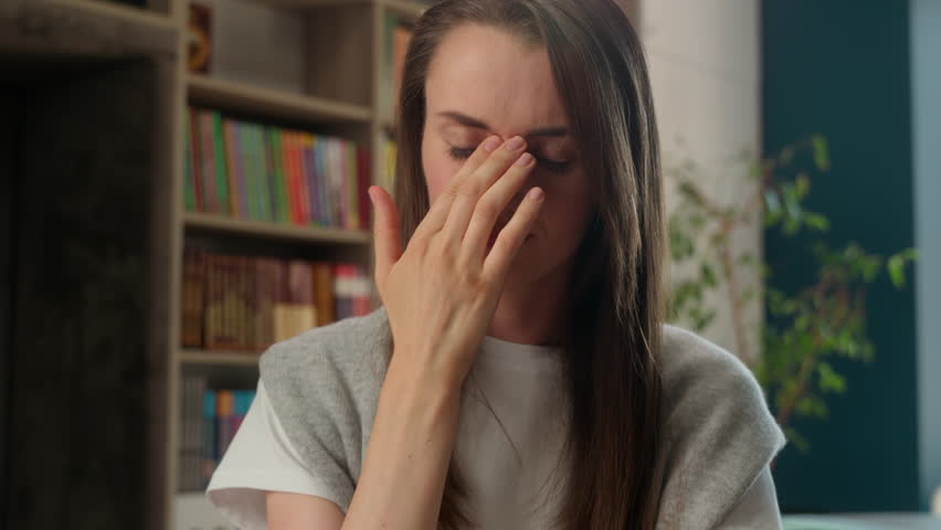 Tired Caucasian woman female girl teacher student school exhausted education learning study stressed headache overworked sad upset university migraine painful head problem ache library suffer college