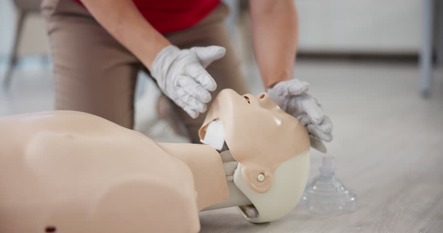 Woman, hands or dummy with CPR breathing for first aid training or class at emergency healthcare practice on floor. Female person, mannequin or paramedic lifting head for airway circulation or rescue