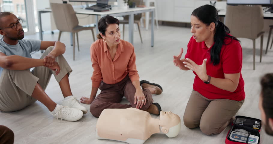 Cpr, teaching and mannequin with woman and workshop for first aid, learning or training. Healthcare, safety course and emergency with people in class for paramedic demonstration, instructor or rescue
