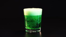Green drink poured, fizzing in a glass - Powered by Shutterstock - Get 15% off with code: PIKWIZARD15