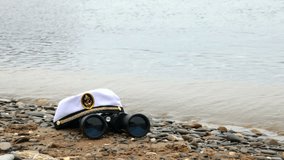 sailor cap and binoculars on the seaside