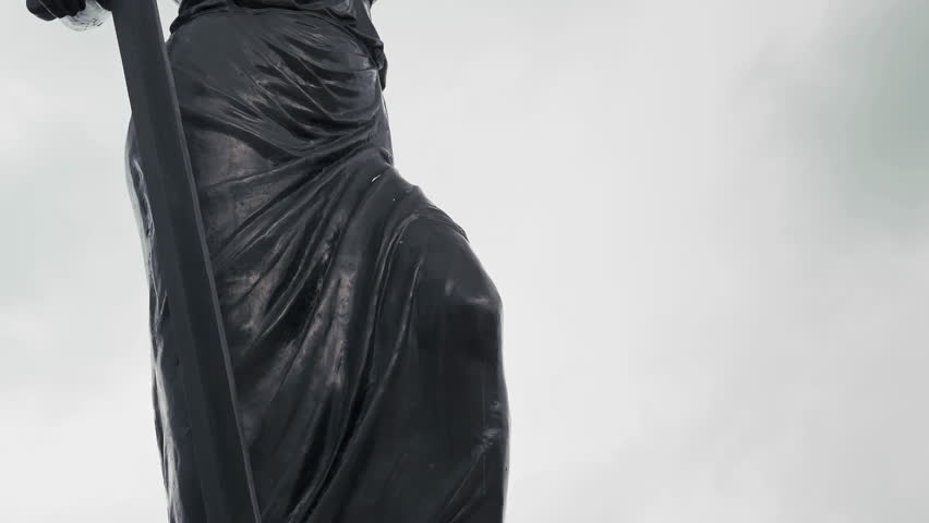 A Sculpture Art of Lady Justice Statue in Cloudy Rainy Day