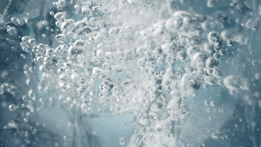Super Slow Motion Shot of Ice and Air Bubbles in Crystal Clear Water at 1000fps.