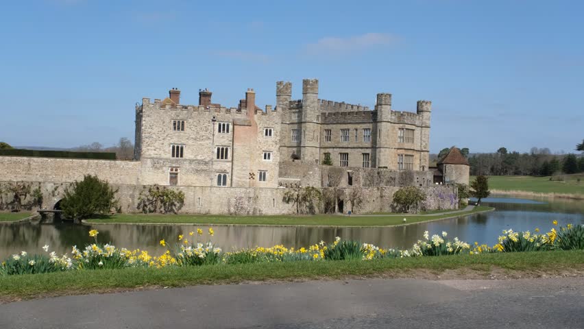 View of Leeds Castle in Kent, UK. Leeds Castle, England, reflection, spring sunny day, with flowers blooming. 