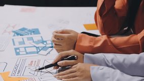Young Asian creative team work together in business brand design project brainstorm meeting. Modern office, colleague coworker, marketing advertisement research or people teamwork concept.
 - Powered by Shutterstock - Get 15% off with code: PIKWIZARD15