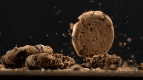 Ultra Slow-Motion Macro Close-Up of Multiple Chocolate Chips Falling onto Table Top with Crumbs Flying, Captured in High-Speed - Powered by Shutterstock - Get 15% off with code: PIKWIZARD15
