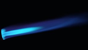 Close up flame of cooking gas blow torch over black background, side view - Powered by Shutterstock - Get 15% off with code: PIKWIZARD15
