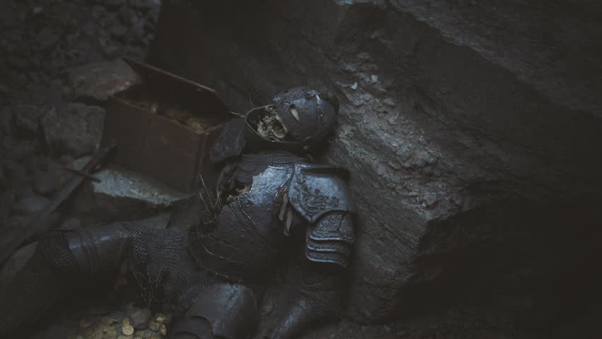 A lifeless knight in rusted armor rests against a rocky cave wall, surrounded by scattered coins and relics of a bygone era, casting an eerie atmosphere in the dim light.