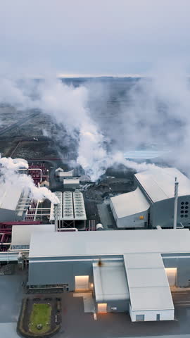 Aerial Vertical view of geothermal energy plant, pipes and smoke chimneys. Iceland