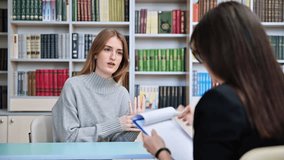 Counselor working with teenage girl college student in office educational building - Powered by Shutterstock - Get 15% off with code: PIKWIZARD15