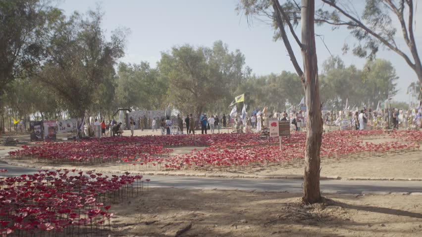 Reim , Israel - 11 10 2024: Slow motion pan shot at the Poppy flower memorial, Nova Music Festival in Southern Israel, Reim