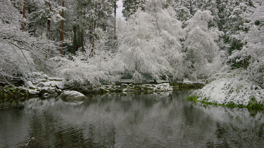 Lithia park with snow and icy cold water pond in Ashland Oregon United States