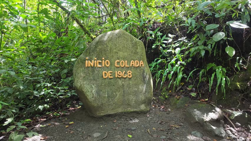 Milestone indicates the beginning of the yellow Lava 68 Flow Trail in the Arenal Volcano National Park, Costa Rica.