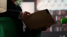 Two espionage agents reviewing confidential documents in a vintage library, emphasizing secret service teamwork and strategic planning for a mission. Reading government reports. Camera B. - Powered by Shutterstock - Get 15% off with code: PIKWIZARD15