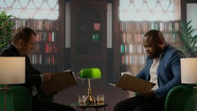 Intelligence agents analyzing sensitive information over a drink, portraying teamwork, professionalism and the essence of a secret mission briefing. Top secret data at the bureau library. Camera A. - Powered by Shutterstock - Get 15% off with code: PIKWIZARD15