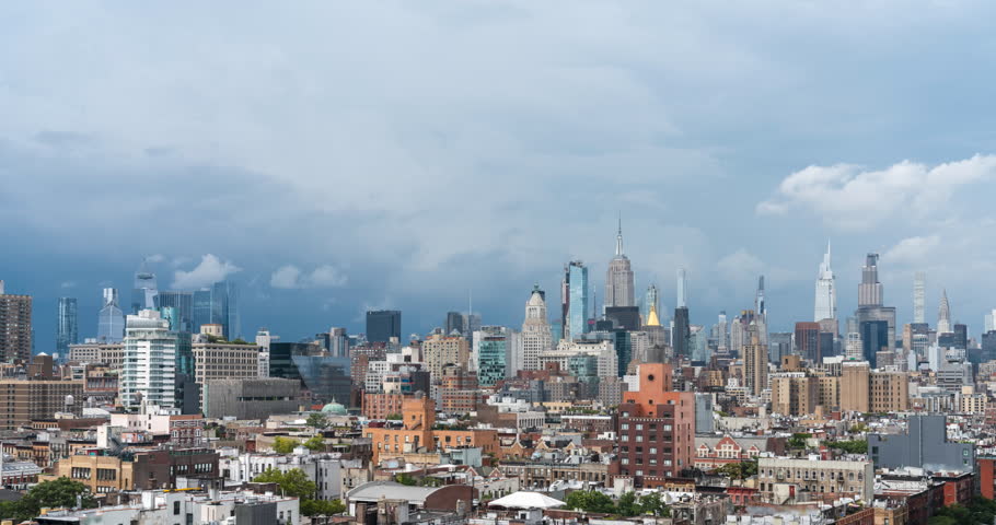 Time lapse of Manhattan skyline with thunderstorm dark clouds coming above New York City
