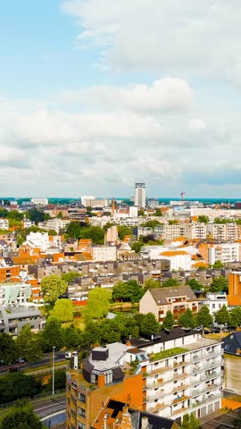 Vertical video. Ghent, Belgium. Panorama of the city from the air. Cloudy weather, summer day, Aerial View. Rich colors