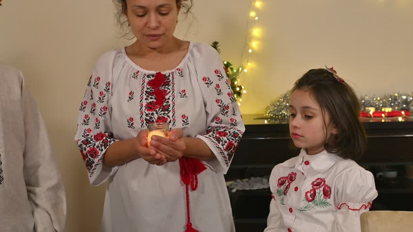 Family Celebrates Ukrainian Christmas Traditions with Embroidered Attire