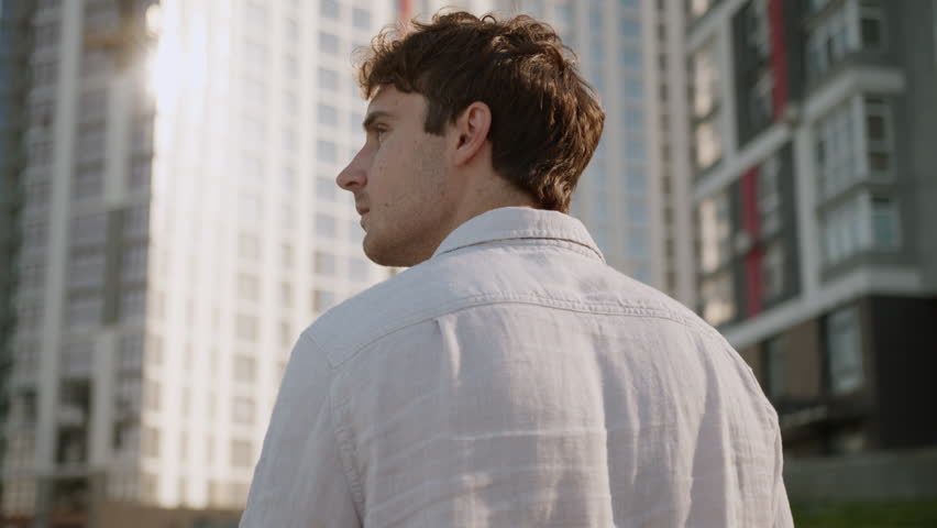 Back view Caucasian man going walking stepping looking around urban male confident guy successful businessman business city outside manager employer leader ceo corporate downtown worker office street