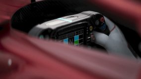 CLOSE-UP High-tech racing cockpit showing a steering wheel and digital display. Realistic 3d rendering. 3D Illustration - Powered by Shutterstock - Get 15% off with code: PIKWIZARD15