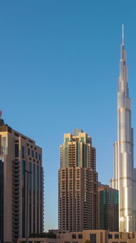 : Panorama of skyscrapers from day to night in Dubai . Time Lapse.